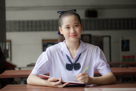 asia thai Junior high school student uniform beautiful girl read a bookの写真素材