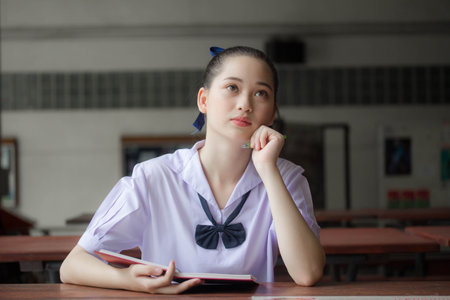 asia thai Junior high school student uniform beautiful girl read a bookの写真素材