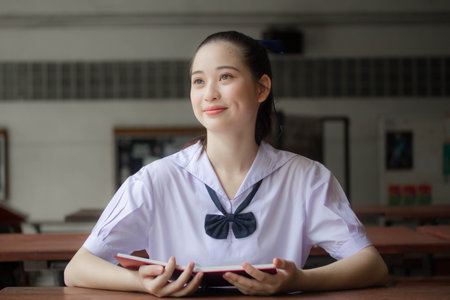 asia thai Junior high school student uniform beautiful girl read a bookの写真素材