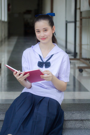 asia thai Junior high school student uniform beautiful girl smile and relaxの写真素材