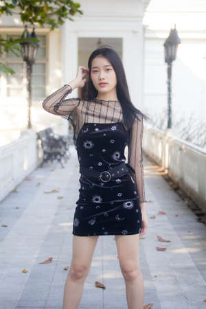 asia thai teen black dress beautiful girl smile and relaxの写真素材
