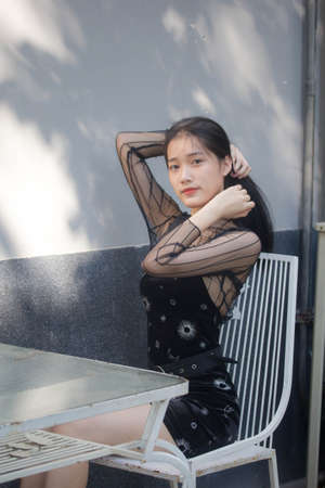 asia thai teen black dress beautiful girl smile and relaxの写真素材