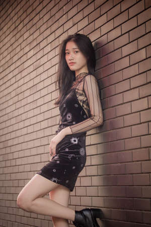 asia thai teen black dress beautiful girl smile and relaxの写真素材