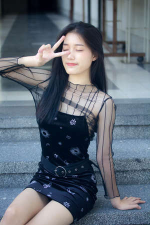 asia thai teen black dress beautiful girl smile and relax