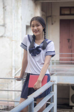 japanese teen beautiful girl in student uniform happy and relaxの写真素材