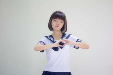 japanese teen beautiful girl in student give heartの写真素材