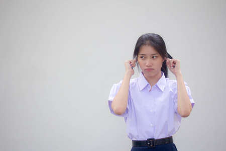 Portrait of thai high school student uniform beautiful girl not listenの写真素材