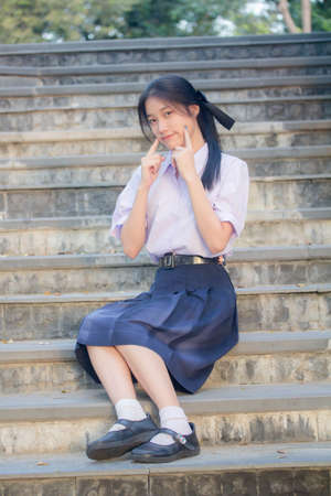 Portrait of thai high school student uniform teen beautiful girl happy and relaxの写真素材