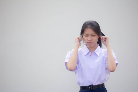 Portrait of thai high school student uniform beautiful girl not listenの写真素材
