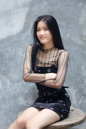 asia thai teen black dress beautiful girl smile and relaxの写真素材