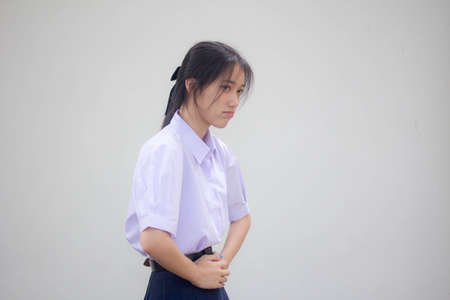 asia thai high school student uniform beautiful girl stomachacheの写真素材