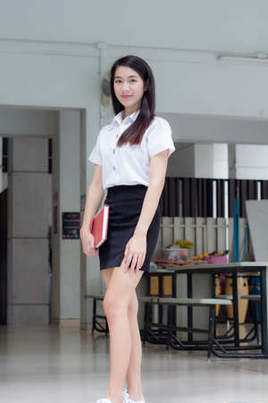 thai adult student university uniform beautiful girl smile and relaxの写真素材