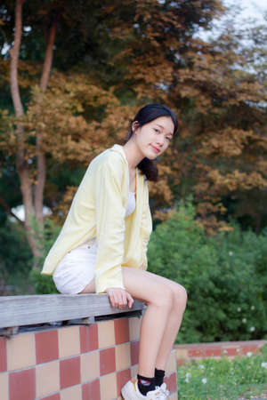 asia thai teen yellow t-shirt beautiful girl smile and relaxの写真素材