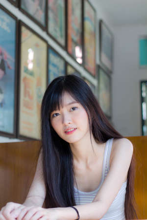 Portrait of japan adult beautiful girl white shirt plaid skirt relax time