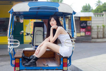 asia thai girl White dress beautiful girl smile and relax