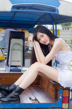 asia thai girl White dress beautiful girl smile and relaxの写真素材