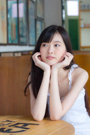 asia thai girl White dress beautiful girl smile and relaxの写真素材