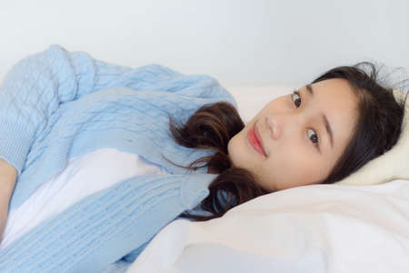 asia thai teen light blue t-shirt beautiful girl smile and relaxの写真素材