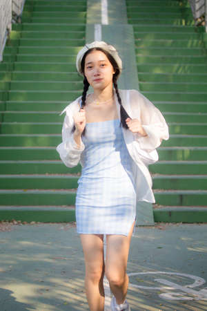 asia thai teen blue dress beautiful girl smile and relaxの写真素材