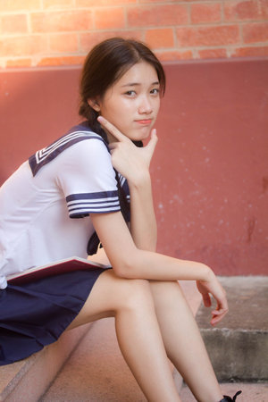 japanese teen beautiful girl in student uniform happy and relaxの写真素材