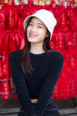 asia thai teen black t-shirt beautiful girl smile and relaxの写真素材