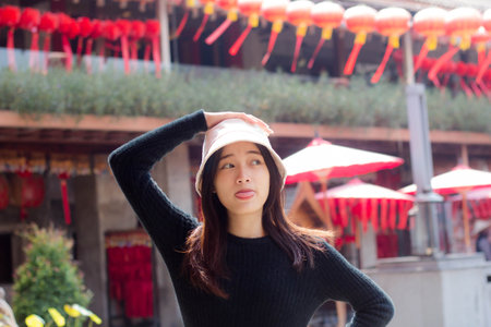 asia thai teen black t-shirt beautiful girl smile and relaxの写真素材