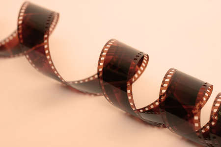 Close up of 35mm negative film, warm tones.の写真素材