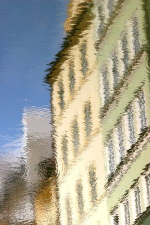 Old buildings in Prague, reflected in the riverの写真素材