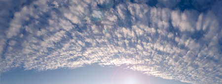 Panorama sky with cumulus clouds high.