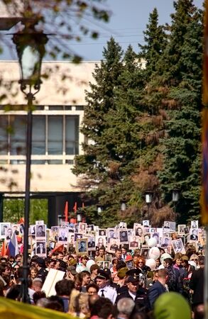 ULYANOVSK, RUSSIA - MAY 9, 2016: Procession of people with flags and photos their relatives in Immortal Regiment on annual Victory Day, May, 9, 2016 in Ulyanovsk city, Russia.のeditorial素材