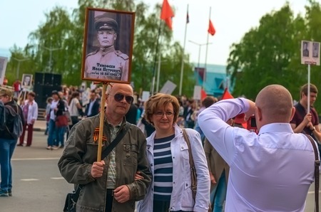 ULYANOVSK, RUSSIA - MAY 9, 2016: ULYANOVSK, RUSSIA - MAY 9, 2016: People after the march Immortal regiment. May, 9, 2016 in Ulyanovsk city, Russia.のeditorial素材