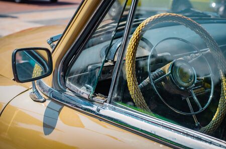 Ulyanovsk, Russia - July 27, 2019. Details of a vintage car close-up. for advertising. The mirror of a collection car of a representative class of the middle of the last centuryのeditorial素材