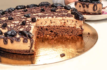 Homemade cake with chocolate cream and prunes
