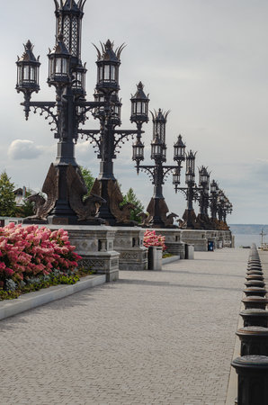 2022-09-13, Russia, Samara region: Garibaldi Castle. Beautiful openwork lamppost decorated with sculptures of a griffin on the squareのeditorial素材