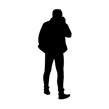 Adult man in jacket walking. Black silhouette isolated on white background. Front view. Monochrome vector illustration of man taking a walk and talking on the phone. Conceptのイラスト素材