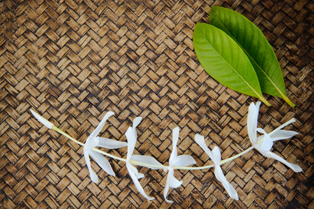 close up Thai flower on bamboo matの写真素材