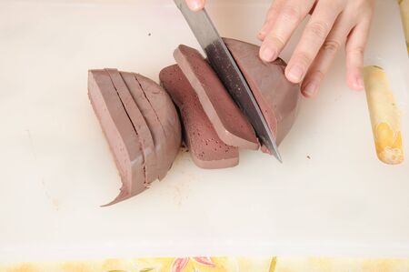 Slice chicken blood to preare for coock thai foodの写真素材