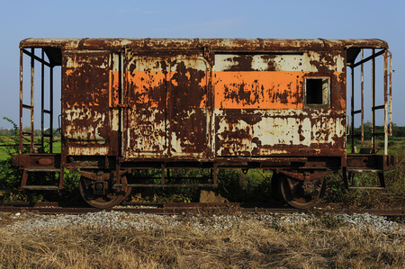 The old vintage train on the rail under blue skyの写真素材