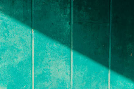 Green color old stripe concrete wall background textureの写真素材