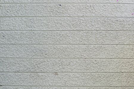 New design white rough concrete wall backgroundの写真素材