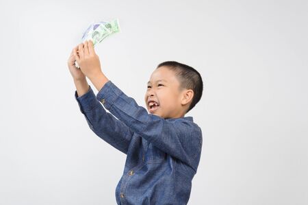 Young boy with happy and smile with korean won bank note on white backgroundの写真素材