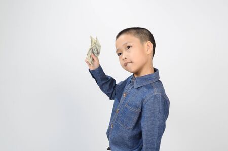 Young boy with happy and smile with american dollar bank noteの写真素材