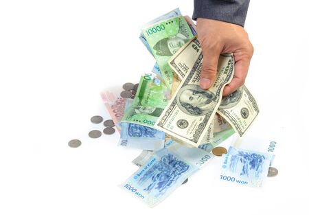 Man hand picking bank note from the white background