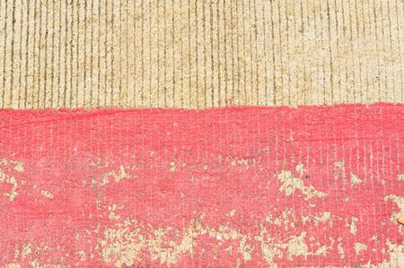Scratch of red line on concrete road backgroundの写真素材