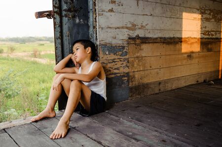 The lonely boy the old train room looking to outsideの写真素材
