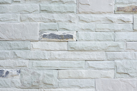 Grey granite stone brick on the wall background