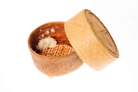 Used bamboo basket for thai sticky rice on white backgroundの写真素材