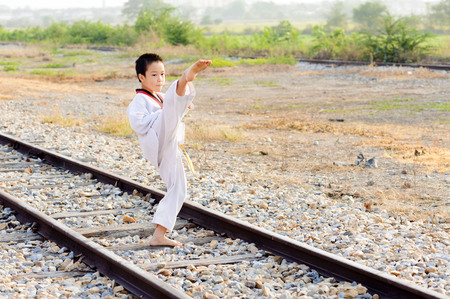 Asian boy practice taekwondo at the construction areaの写真素材