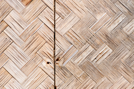 Close up old Woven flat mat made from bamboo grass backgroundの写真素材