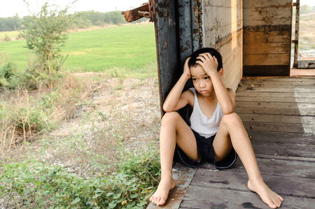 The lonely boy the old train room looking to outsideの写真素材
